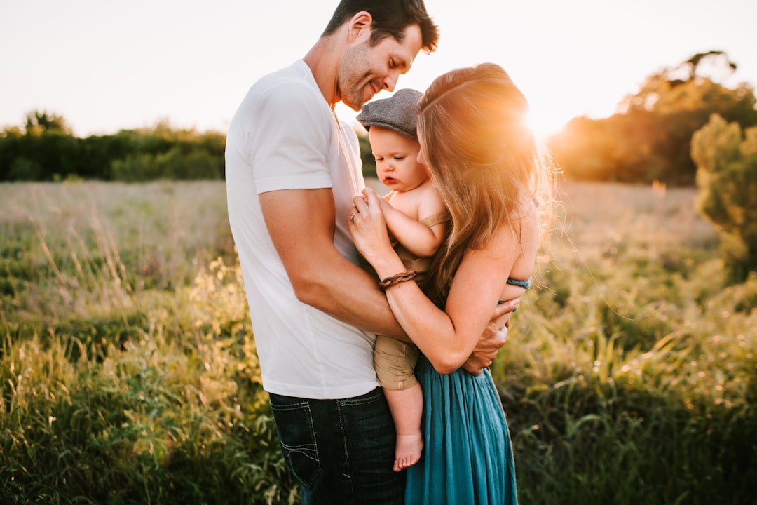 Plano Life Insurance for Tech Professionals: Your Year-End Planning Guide 9 family photo on green grass during golden hour
