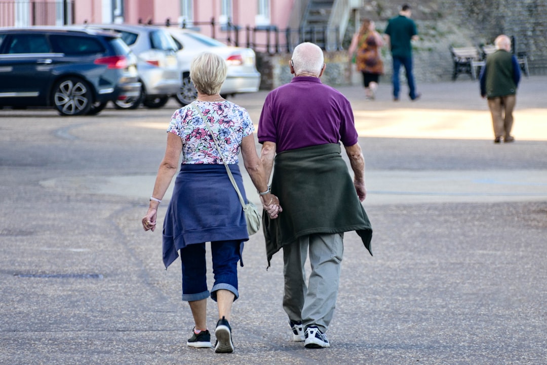 Empty Nesters: How to Adjust Your Insurance as Your Life Changes 2 man and woman walking on the street during daytime